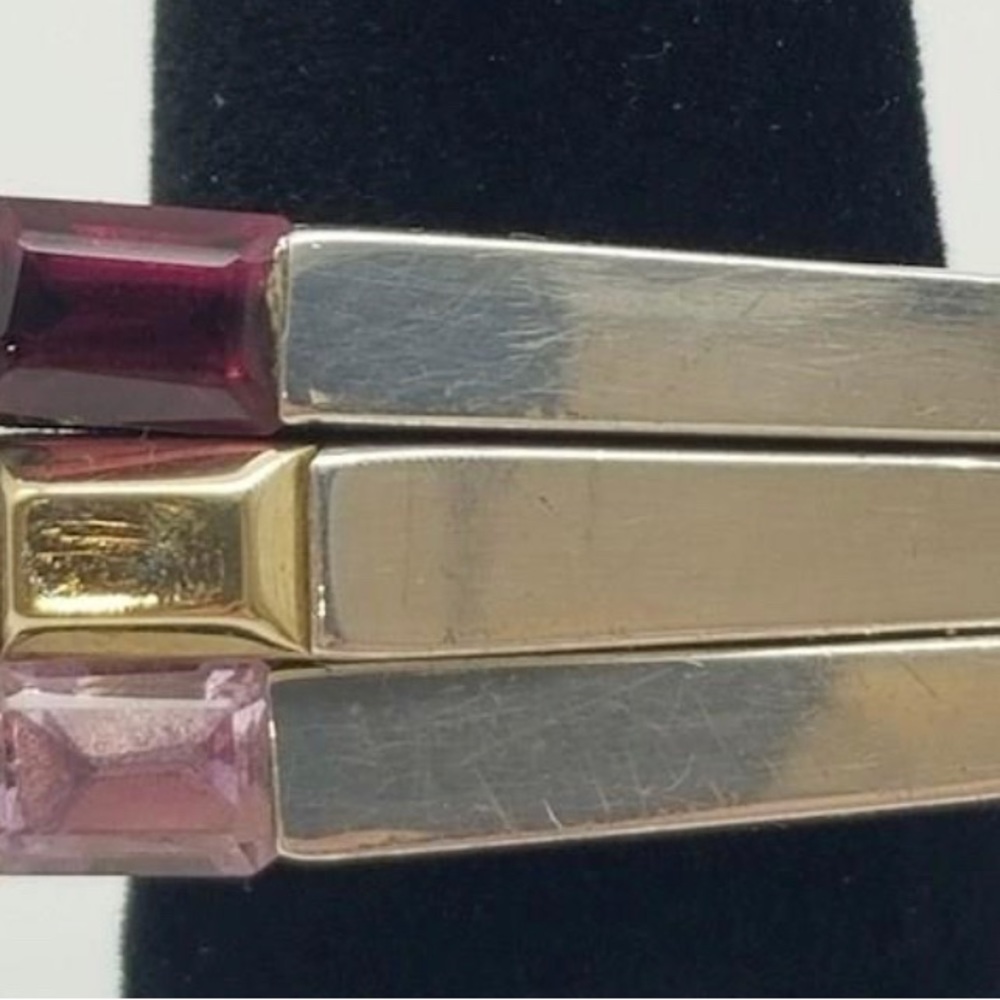 Tom Solow trio stacking sterling rings with gold, ruby and garnet accents